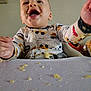 baby, child, high_chair, food, messy, smiling, happy, indoor, onesie, table, face, mouth_open, hand, seat, feeding, cute, infant, playful, expression, toddler