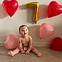 child, baby, infant, balloons, heart_balloon, gold_balloon, number_balloon, number_7, kiss_marks, lipstick_marks, diaper, sitting, smile, floor, wall, celebration, birthday, party, joy, cute