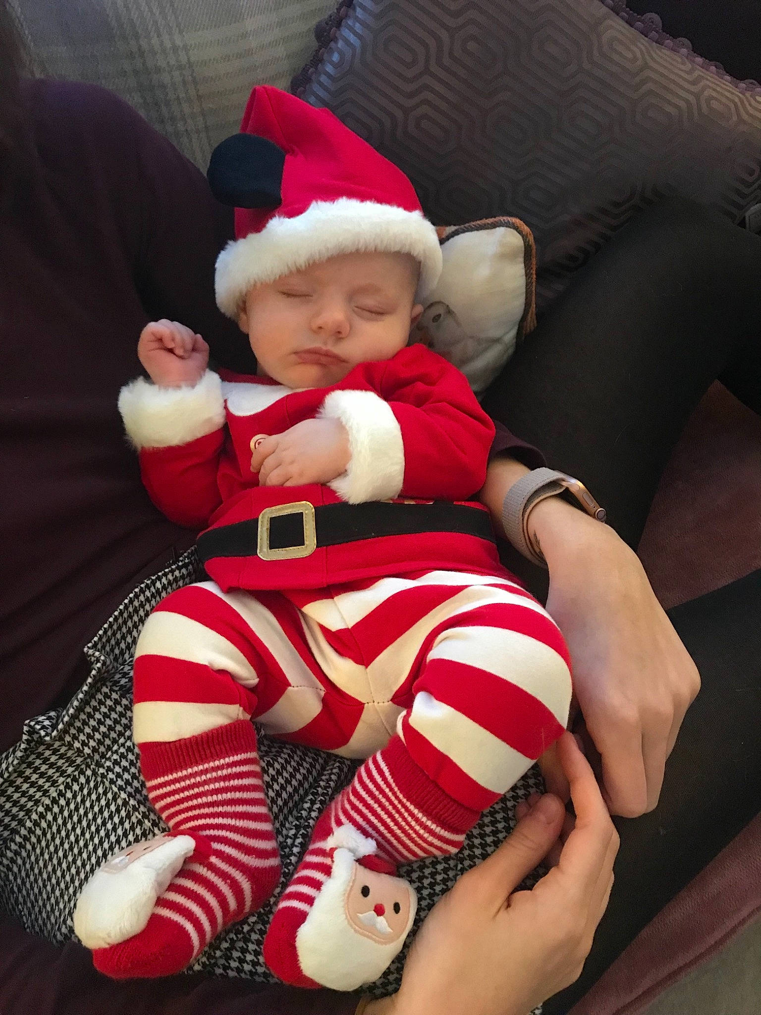 Harris is registered to the contest to win money with this photo: baby, child, christmas, christmas_eve, fictional_character, holiday, human_body, lap, leg, person, red, santa_claus, sitting, smile, thigh, toddler