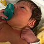 newborn, baby, pacifier, blanket, hospital_bracelet, infant, skin, hand, face, ear, hair, lying_down, closeup, soft_texture, bed, resting, human, newborn_baby, hospital, cute