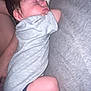 baby, sleeping, infant, couch, blanket, clothing, person, face, head, skin, hair, arm, leg, comfort, rest, indoor, cozy, toddler, peaceful, nap