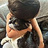 Tom joined the competition — help win amazing prizes! child, cat, hugging, black_and_white_cat, indoor, couch, affection, pet, love, comfort, furniture, human, animal, close_up, domestic_animal, yellow_eyes, short_hair, casual_clothing, relaxed, bond