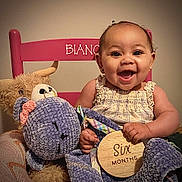 Bianca joined the competition — help win amazing prizes! baby, child, smiling, teddy_bear, stuffed_animal, chair, pink, wooden_sign, six_months, happy, infant, cute, portrait, indoor, face, person, clothing, plush, holding, sitting