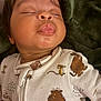 Addison is registered to the contest to win money with this photo: baby, sleeping, onesie, cartoon, animal_print, face, child, infant, cute, soft, blanket, cozy, resting, peaceful, lips, puckered, portrait, indoor, young, toddler