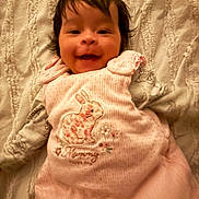 Addison joined the competition — help win amazing prizes! baby, infant, smiling, pink_clothing, bunny, blanket, cute, child, portrait, happy, laying_down, soft_texture, face, toddler, cozy, indoors, apparel, person, young_child, sleepwear