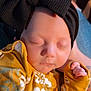 Montana is registered to the contest to win money with this photo: baby, sleeping, headband, bow, black, yellow, floral, clothing, infant, peaceful, cute, hand, closed_eyes, soft_light, portrait, child, newborn, warm, cozy, denim