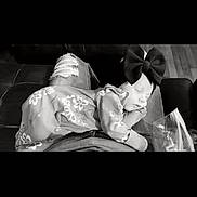 Montana joined the competition — help win amazing prizes! baby, child, sleeping, bow_headband, floral_outfit, ripped_jeans, lap, indoor, couch, person, head, face, clothing, relaxing, peaceful, black_and_white, floor, comfort, cozy, portrait