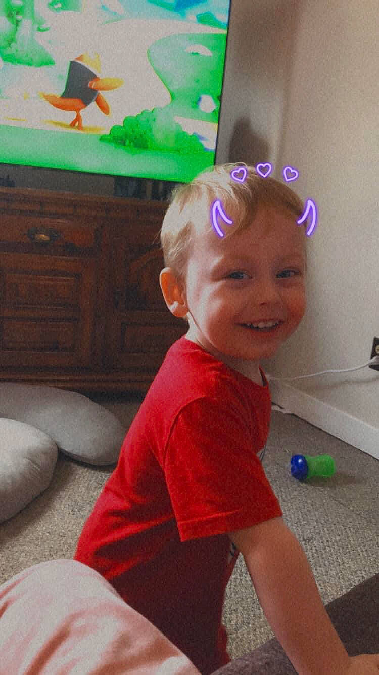 Regan is registered to the contest to win money with this photo: baby, bathroom, child, floor, flooring, fun, happy, head, joy, magenta, party_supply, person, play, room, sitting, smile, t_shirt, toddler, vacation, visual_arts