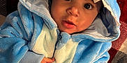 Ozias joined the competition — help win amazing prizes! baby, blanket, bodypart, bonnet, cap, clothing, face, finger, hand, hat, head, hood, hoodie, knitwear, person, photography, portrait, sweater, sweatshirt, towel