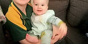 Cody joined the competition — help win amazing prizes! baby, casual, child, clothing, couch, cozy, curtain, cute, face, family, furniture, happy, holding, indoor, infant, person, portrait, sibling, smile, young
