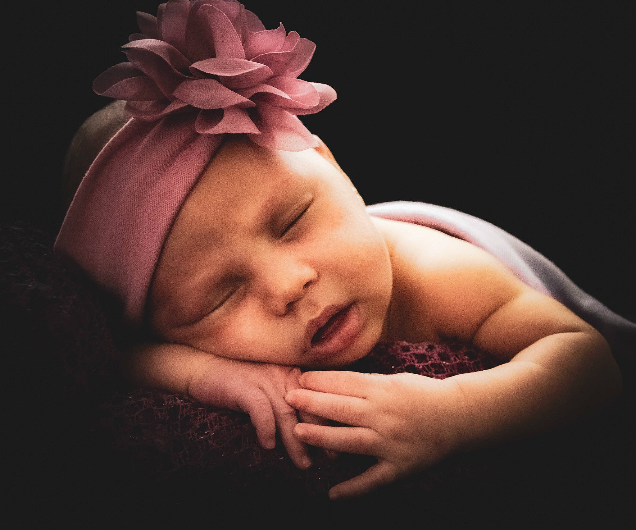 Zariah is registered to the contest to win money with this photo: baby, baby_toddler_clothing, cheek, child, comfort, darkness, event, eye, face, fashion_accessory, flash_photography, happy, headband, headgear, headpiece, headwear, lip, person, petal, skin