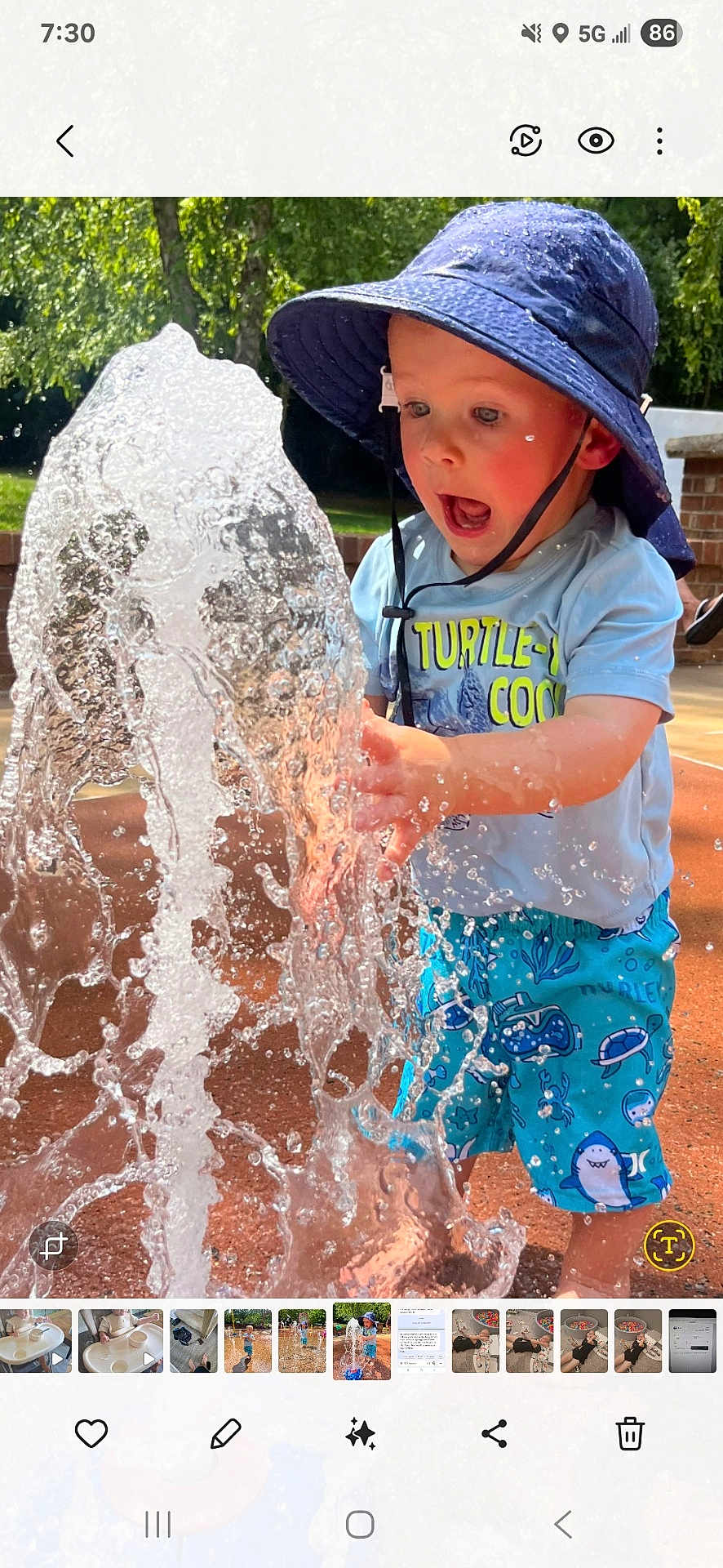 Griffin joined the competition — help win amazing prizes! child, toddler, water, splash, hat, shorts, blue, outdoor, summer, play, fun, sunlight, expression, water_spray, curiosity, person, nature, daylight, park, clothing