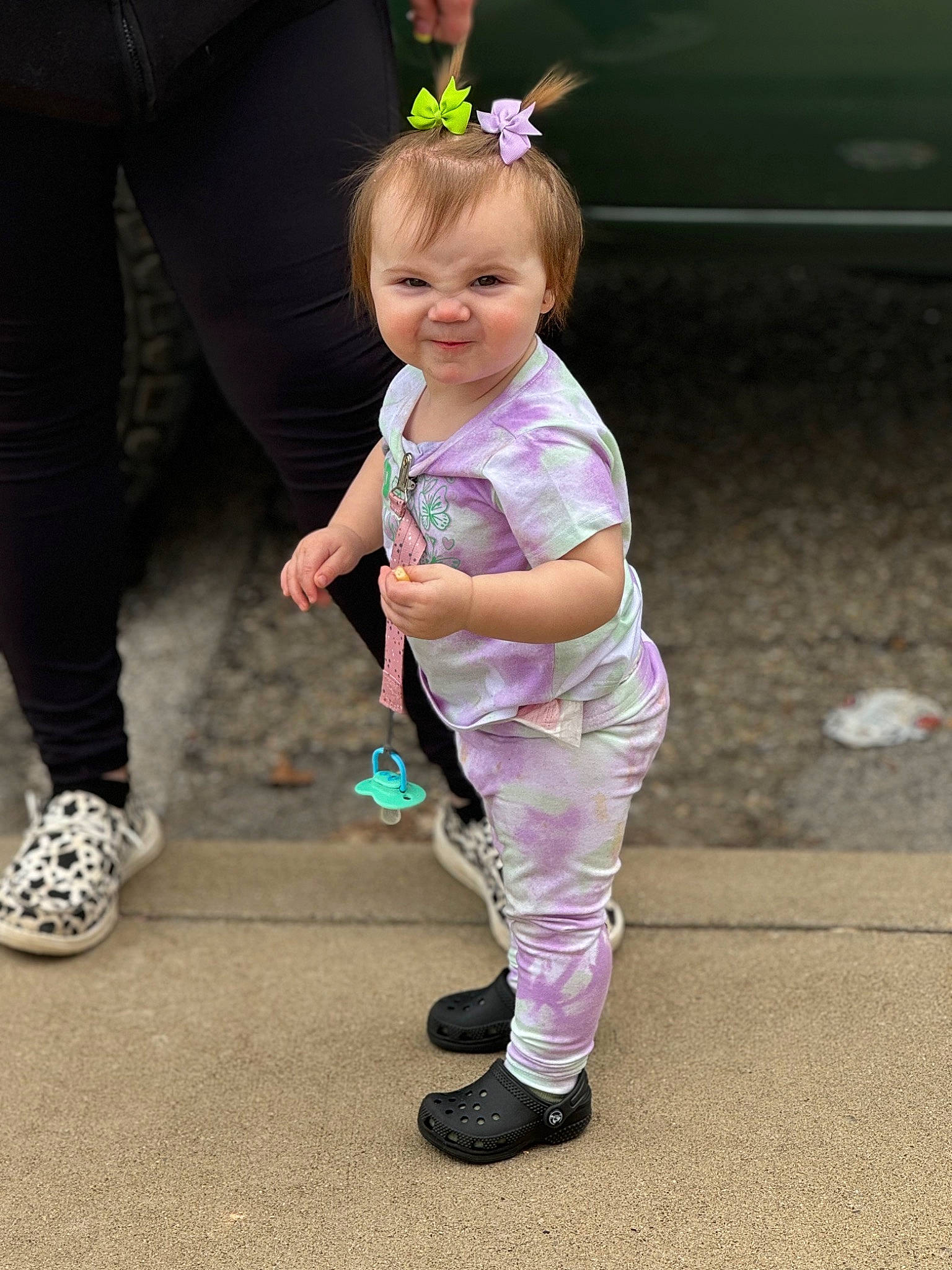 Ellah is registered to the contest to win money with this photo: baby, child, event, fashion_accessory, footwear, fun, gesture, grass, happy, human_leg, joy, leisure, magenta, person, pink, plant, recreation, shoe, smile, toddler