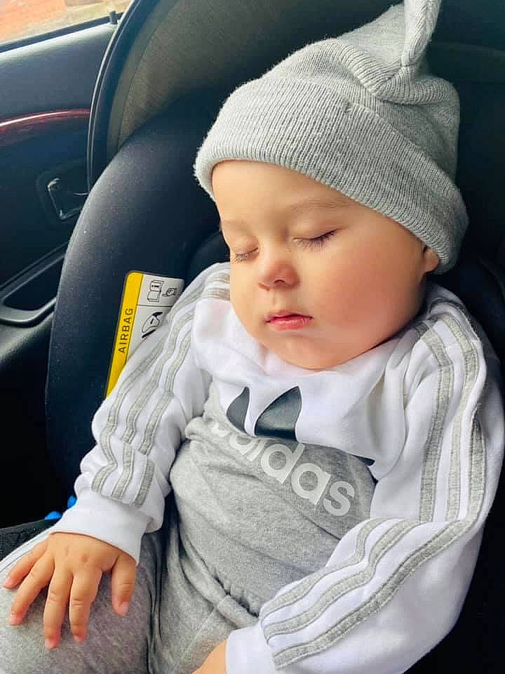 Kevin joined the competition — help win amazing prizes! baby, baby_toddler_clothing, cap, car_seat, cheek, child, comfort, cool, eye, head_restraint, headwear, lip, mammal, person, product, sitting, skin, sleeve, steering_wheel, toddler