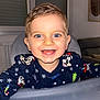 toddler, child, smiling, happy, face, blue_eyes, high_chair, sweater, disney, indoor, portrait, cute, person, clothing, table, home, holiday, joy, baby, cheerful