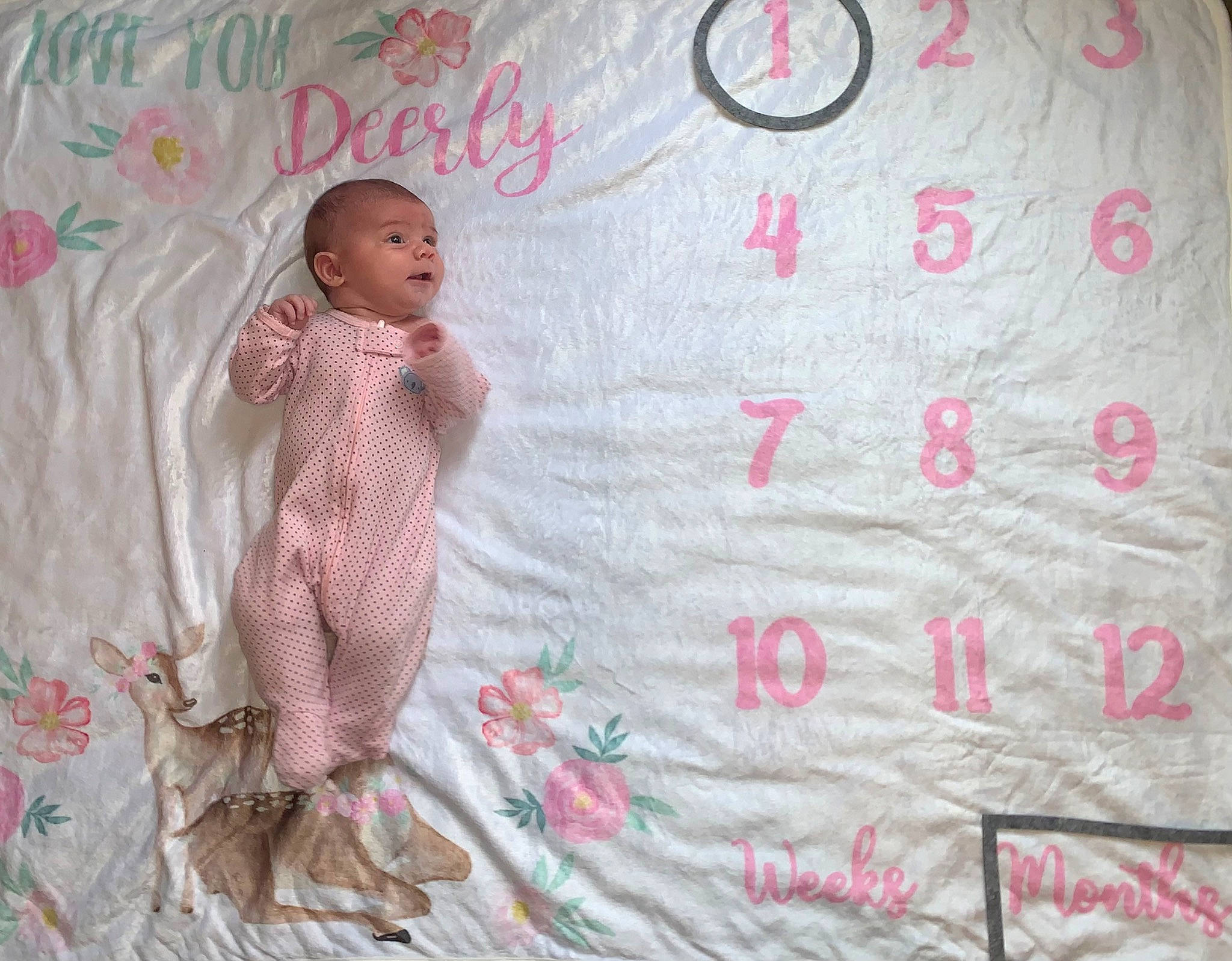 Everleigh is registered to the contest to win money with this photo: baby, baby_products, baby_toddler_clothing, bedding, child, circle, craft, linens, magenta, pattern, peach, person, pink, product, room, sleeve, t_shirt, textile, toddler, wood