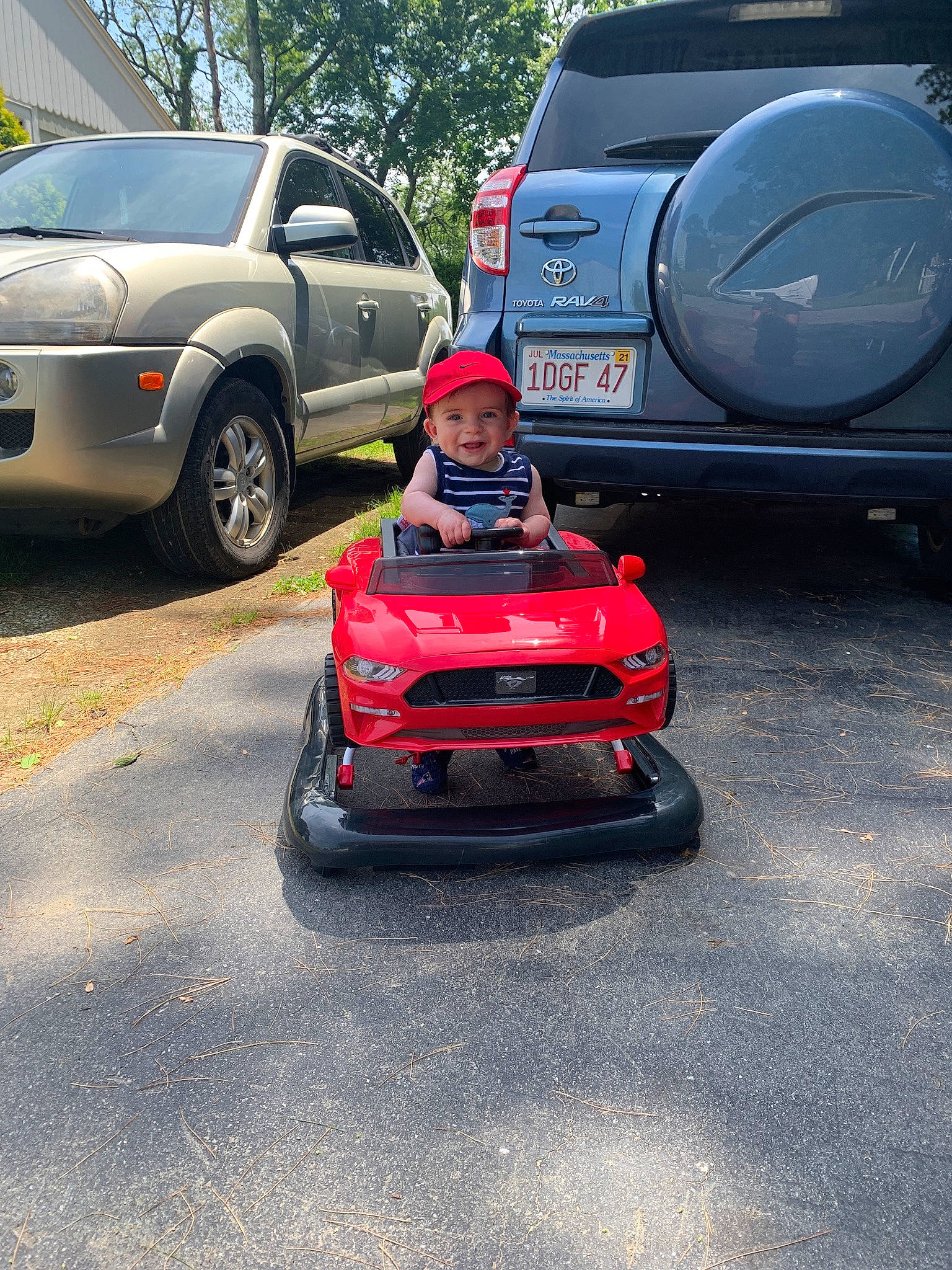 Dalton is registered to the contest to win money with this photo: asphalt, automotive_design, automotive_exterior, automotive_window_part, bumper, car, city_car, compact_car, family_car, headwear, joy, land_vehicle, motor_vehicle, parking, person, plant, road, subcompact_car, vehicle