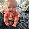 Daxton joined the competition — help win amazing prizes! baby, child, infant, crawling, orange_shirt, bed, pillow, indoor, happy, smiling, cute, person, face, skin, hair, furniture, blanket, window, room, childhood