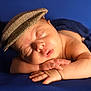 adorable, baby, blue_blanket, calm, cap, child, closeup, cozy, cute, face, hands, hat, infant, newborn, peaceful, portrait, resting, skin, sleeping, soft
