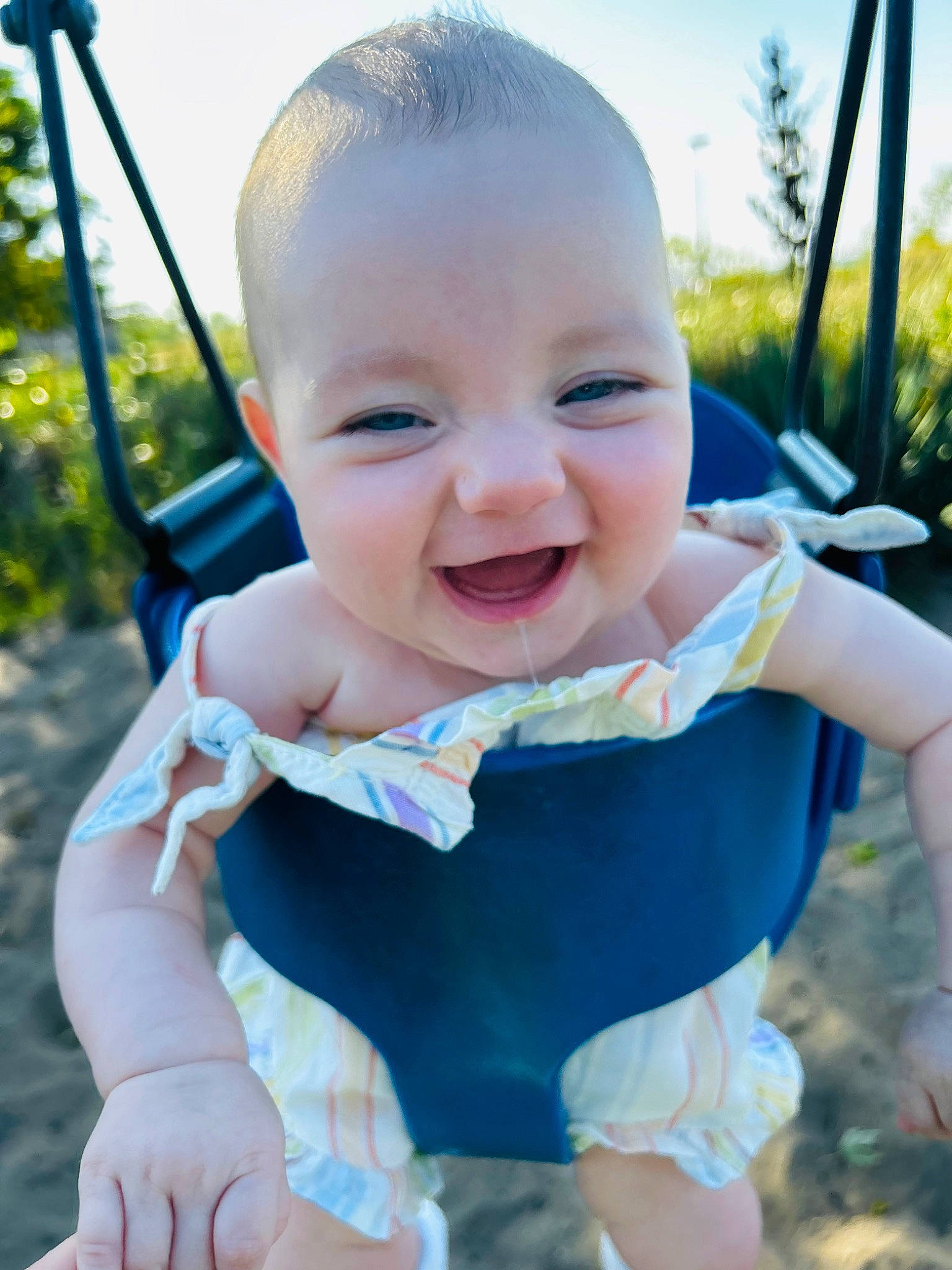 Josephine is registered to the contest to win money with this photo: baby, baby_toddler_clothing, beauty, child, electric_blue, facial_expression, finger, fun, grass, happy, joy, leisure, person, plant, recreation, sitting, skin, sky, smile, summer