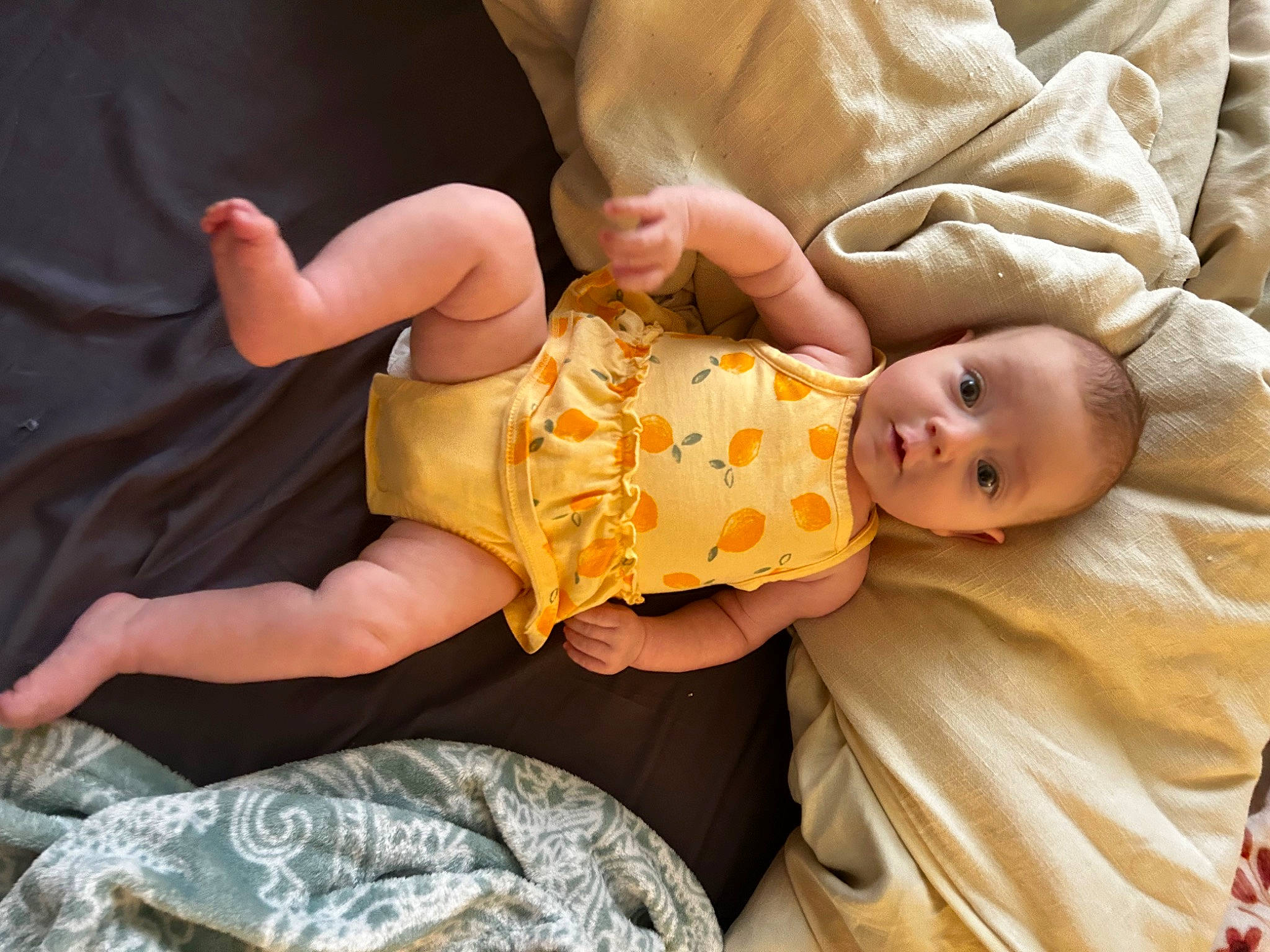 Josephine is registered to the contest to win money with this photo: baby, baby_products, baby_toddler_clothing, camouflage, child, comfort, eye, finger, fun, hand, happy, head, human_body, military_camouflage, nail, pattern, person, room, sitting, skin