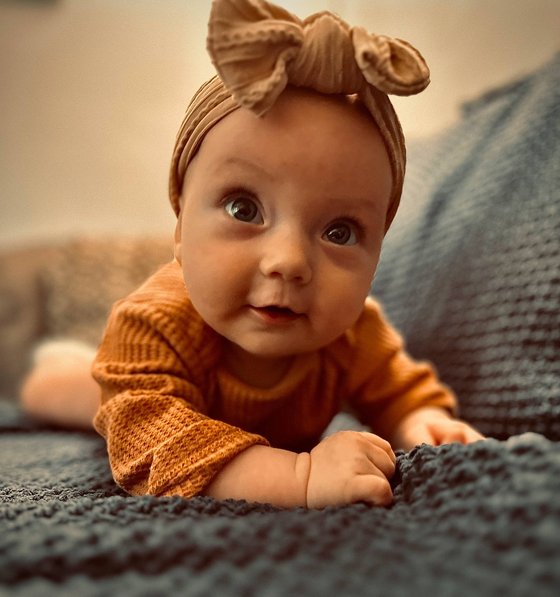Josephine is registered to the contest to win money with this photo: baby, baby_toddler_clothing, cheek, child, comfort, ear, eyelash, flash_photography, flooring, fun, happy, headpiece, human_body, iris, nose, person, room, skin, thumb, toddler