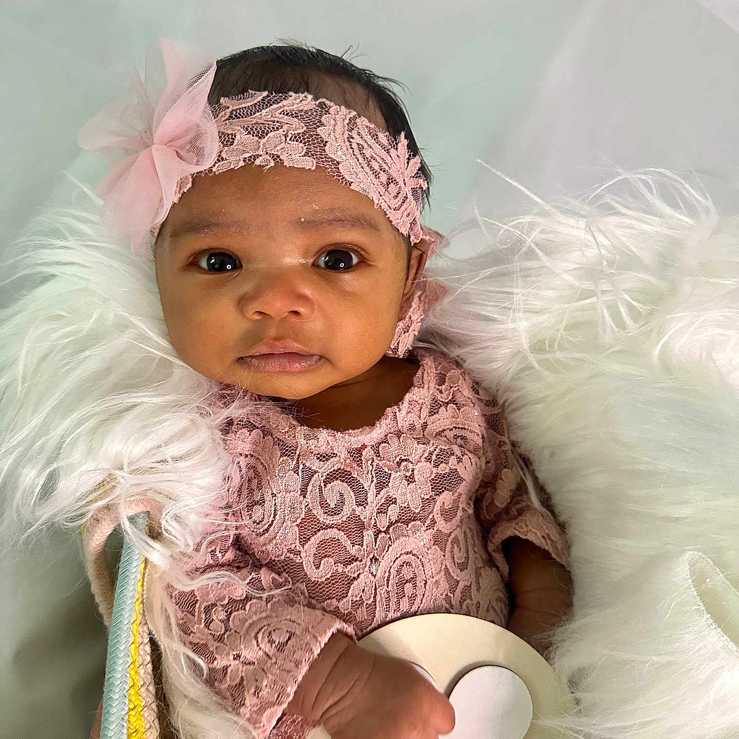 Elianna joined the competition — help win amazing prizes! baby, basket, blanket, child, cozy, cute, eyes, face, flower_accessory, fluffy, hand, headband, indoor, infant, newborn, pink_lace, portrait, soft_texture, toy, wooden_toy