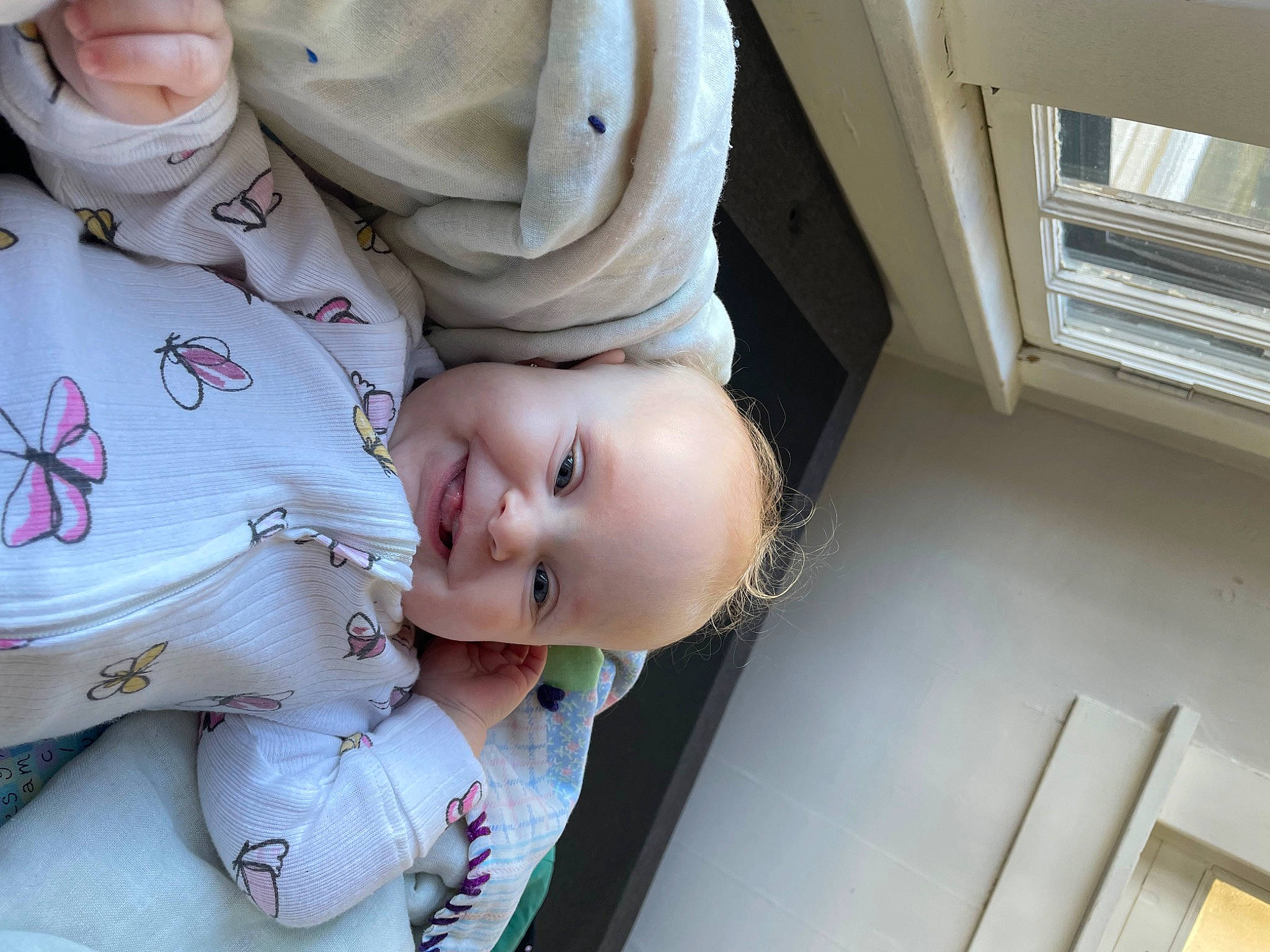 Amia is registered to the contest to win money with this photo: baby, baby_products, baby_toddler_clothing, cheek, child, comfort, dress, eye, fun, happy, hat, joy, person, portrait_photography, room, sleeve, smile, t_shirt, toddler, tree