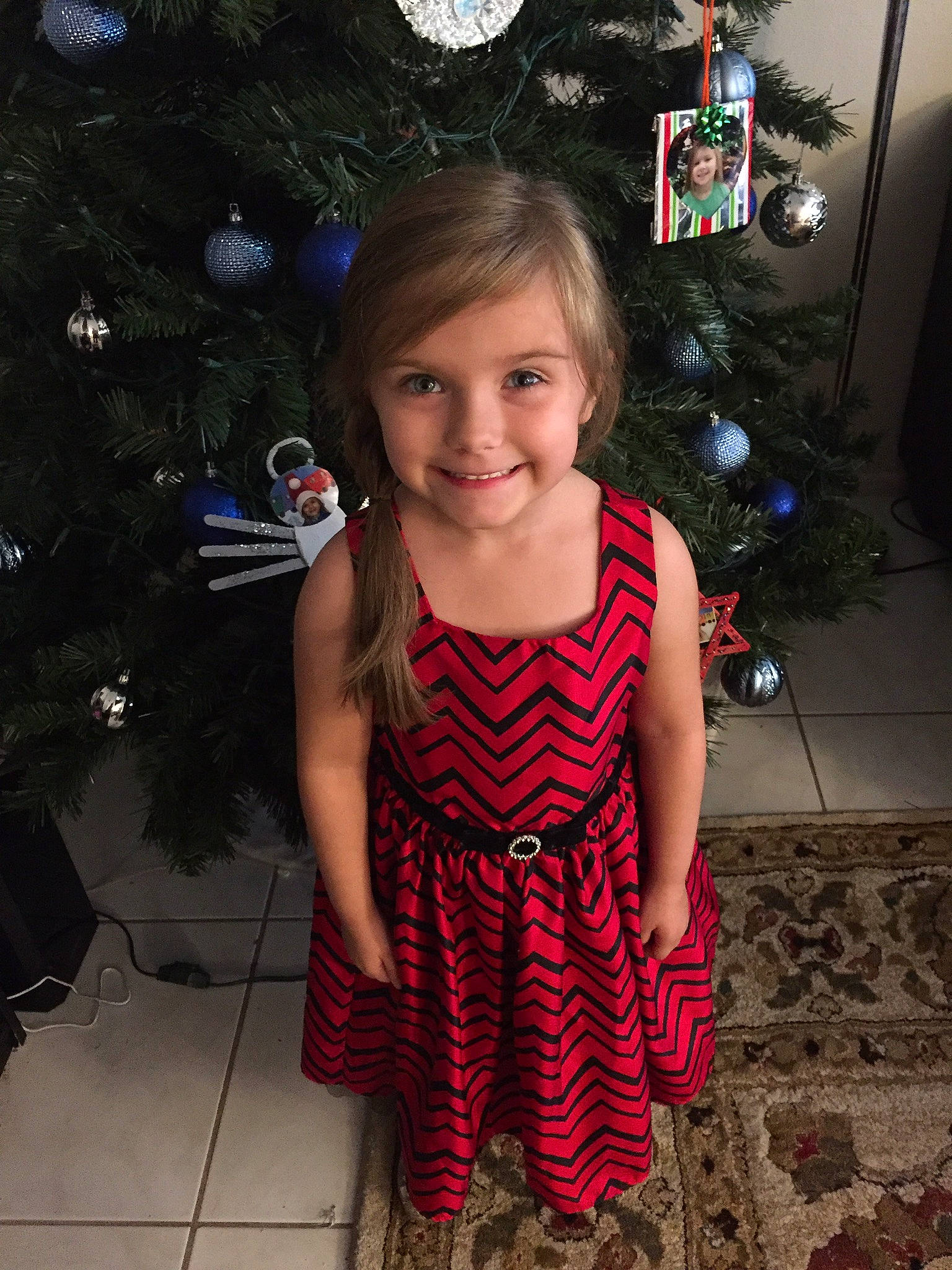 Kaidance is registered to the contest to win money with this photo: beauty, child, christmas, day, dress, emotion, facial_expression, fun, girl, hair, hairstyle, human_hair_color, joy, organ, person, red, shoulder, skin, smile, standing