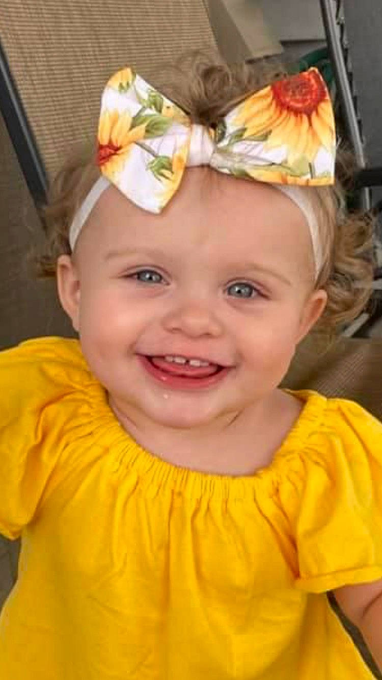 Evee is registered to the contest to win money with this photo: baby, baby_toddler_clothing, cheek, child, chin, face, facial_expression, fun, hairstyle, happy, head, headgear, headpiece, headwear, iris, joy, person, pink, skin, sleeve