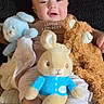 Julyan joined the competition — help win amazing prizes! baby, child, plush_toy, blue_bunny, brown_bear, beige_bunny, couch, blanket, socks, clothing, happy, smile, indoor, portrait, cute, soft_toys, seated, cozy, infant, face