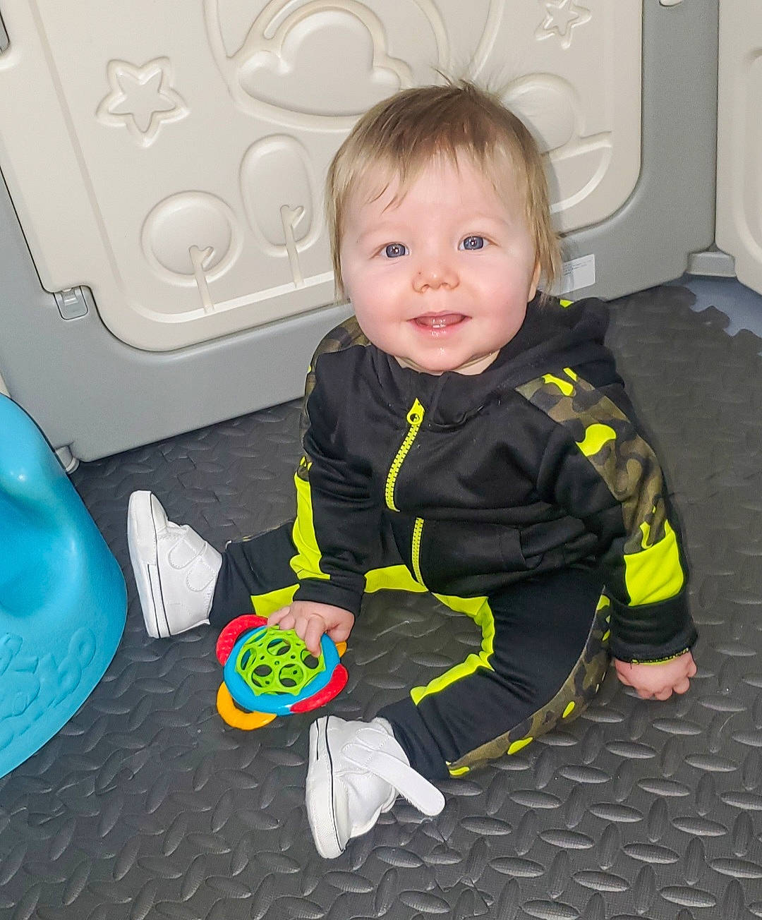 Greyson joined the competition — help win amazing prizes! baby, baby_toddler_clothing, blue, cheek, child, flooring, fun, gas, happy, joy, person, personal_protective_equipment, play, room, sitting, skin, sleeve, smile, t_shirt, toddler