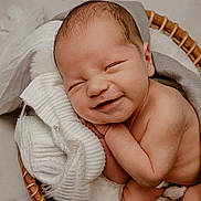 Lincoln joined the competition — help win amazing prizes! newborn, baby, smile, sleeping, basket, blanket, cozy, infant, cute, skin, head, hands, peaceful, resting, soft, warm, lying, portrait, closeup, babycare