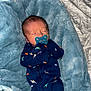 Bryler joined the competition — help win amazing prizes! baby, bed, blanket, blue_blanket, child, clothing, cozy, cuteness, dinosaur_pattern, footwear, green_socks, indoors, infant, newborn, onesie, pacifier, person, rest, sleeping, soft_texture