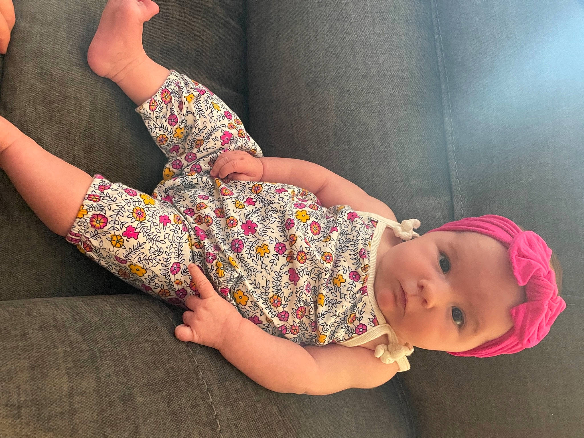 Gabby is registered to the contest to win money with this photo: baby, baby_toddler_clothing, comfort, day_dress, dress, headgear, headwear, human, human_body, joint, knee, leg, nail, one_piece_garment, pattern, person, pink, skin, sleeve, thigh