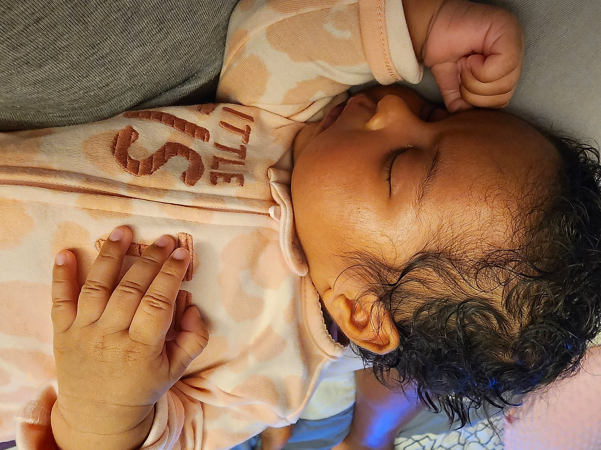 Zoie is registered to the contest to win money with this photo: baby, cheek, chest, comfort, eye, eyelash, facial_expression, finger, gesture, hand, head, human_body, joint, mouth, muscle, neck, nose, organ, person, skin