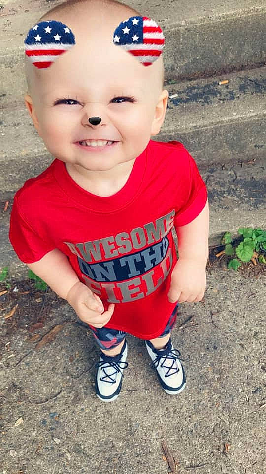 Henry is registered to the contest to win money with this photo: baby, baby_toddler_clothing, cheek, child, chin, cool, face, facial_expression, forehead, head, headgear, headwear, joy, lip, mouth, nose, person, red, skin, sleeve