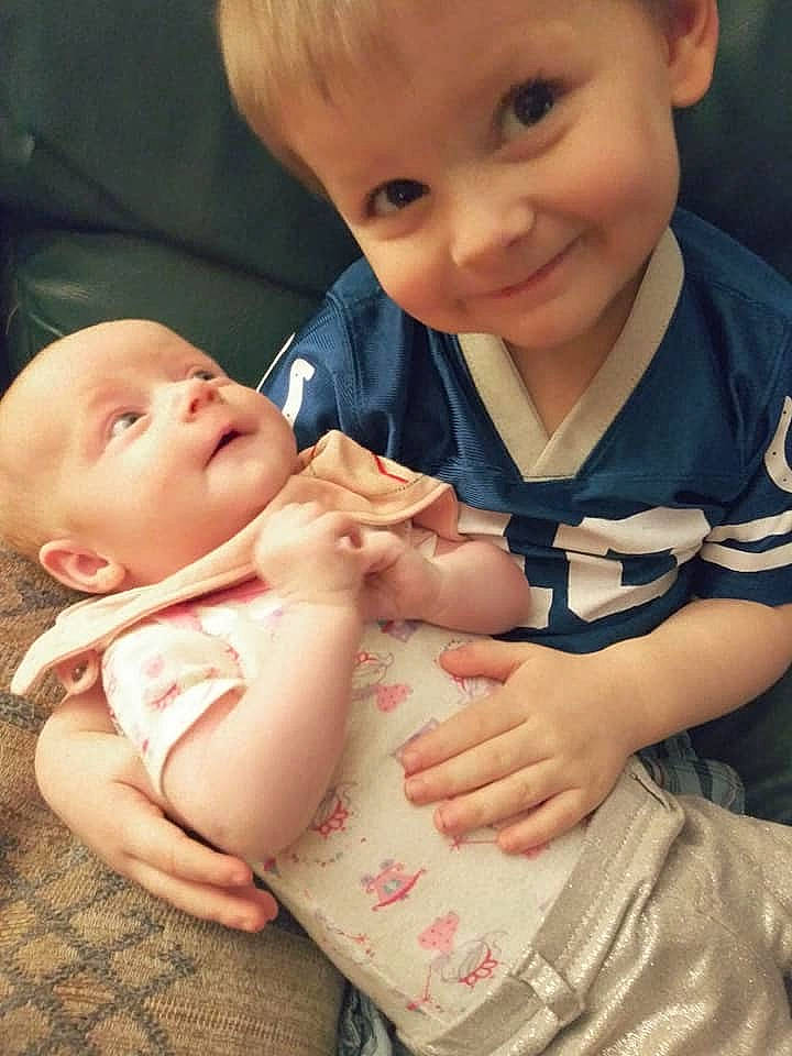 Henry is registered to the contest to win money with this photo: baby, cheek, child, eye, finger, gesture, hand, joy, lip, mouth, nose, person, product, sibling, skin, smile, thumb, toddler