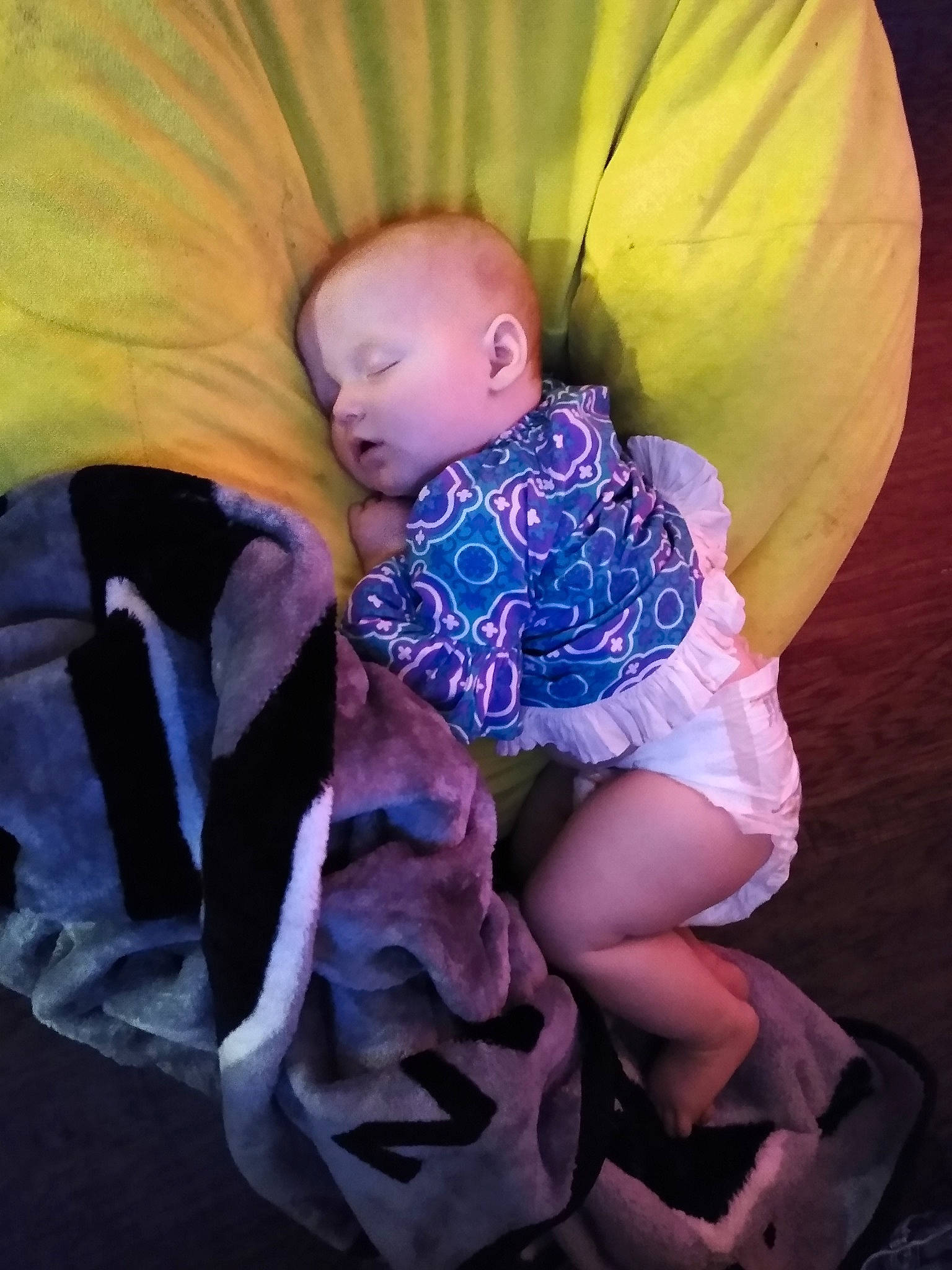 Jane is registered to the contest to win money with this photo: baby, child, person, photography, purple, sitting, sleep, toddler