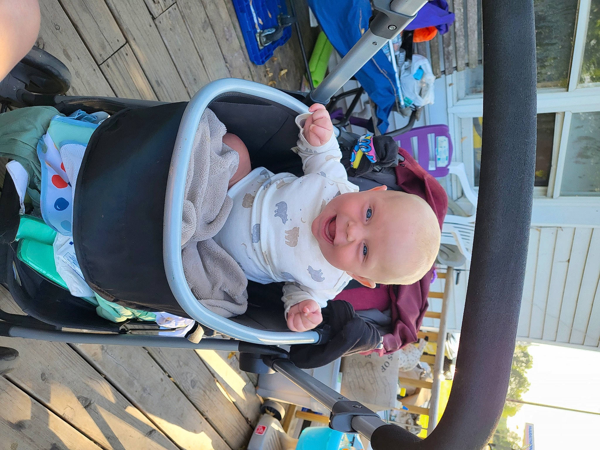 Devin is registered to the contest to win money with this photo: baby, baby_carriage, baby_products, baby_toddler_clothing, child, fun, hat, joy, leisure, person, plant, recreation, smile, toddler, tree, vacation, wheel