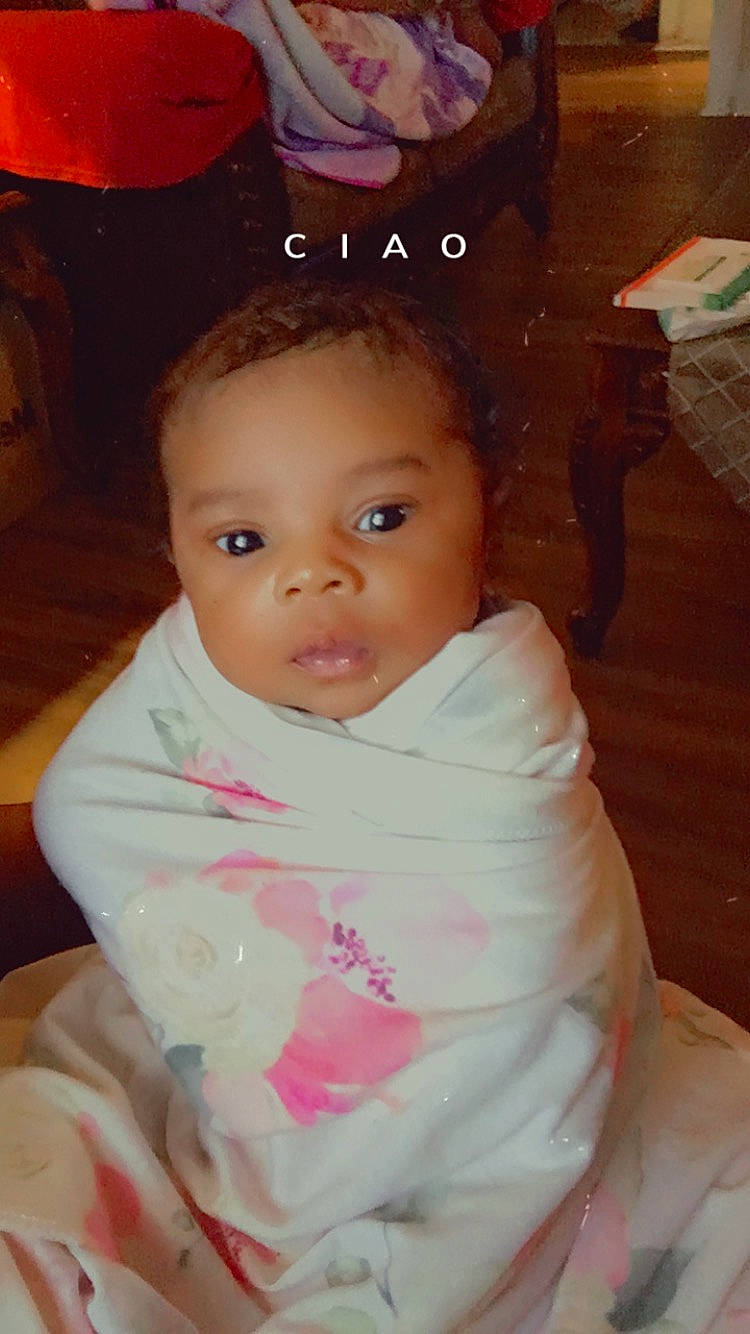 Aubree is registered to the contest to win money with this photo: baby, baby_toddler_clothing, cheek, child, chin, dress, eyebrow, eyelash, facial_expression, fashion_accessory, fun, happy, iris, lip, nose, person, pink, sitting, skin, sleeve