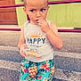 child, boy, snack, sitting, steps, colorful_clothing, pineapple_pattern, tank_top, window, railing, outdoor, daylight, concrete, granite, expression, casual, shorts, food, holding, curious