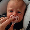 Eleanor joined the competition — help win amazing prizes! baby, infant, pacifier, hand, car_seat, close_up, expression, comfort, child, newborn, face, skin, person, young, seat, clothing, human, cute, care, childhood