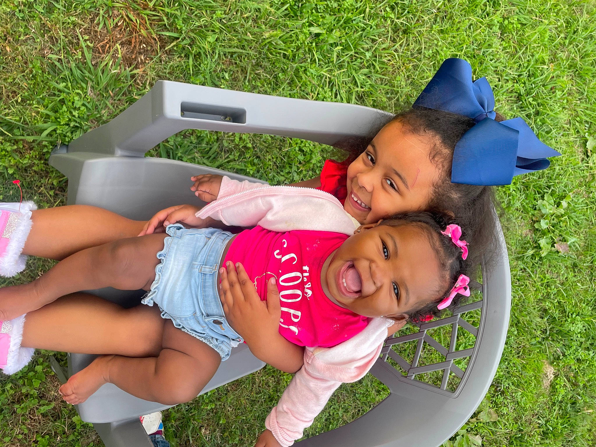 Brinleigh is registered to the contest to win money with this photo: arm, baby_toddler_clothing, clothing, facial_expression, fun, grass, happy, hat, joy, lawn, leg, leisure, people_in_nature, person, pink, recreation, shoe, shorts, smile, summer