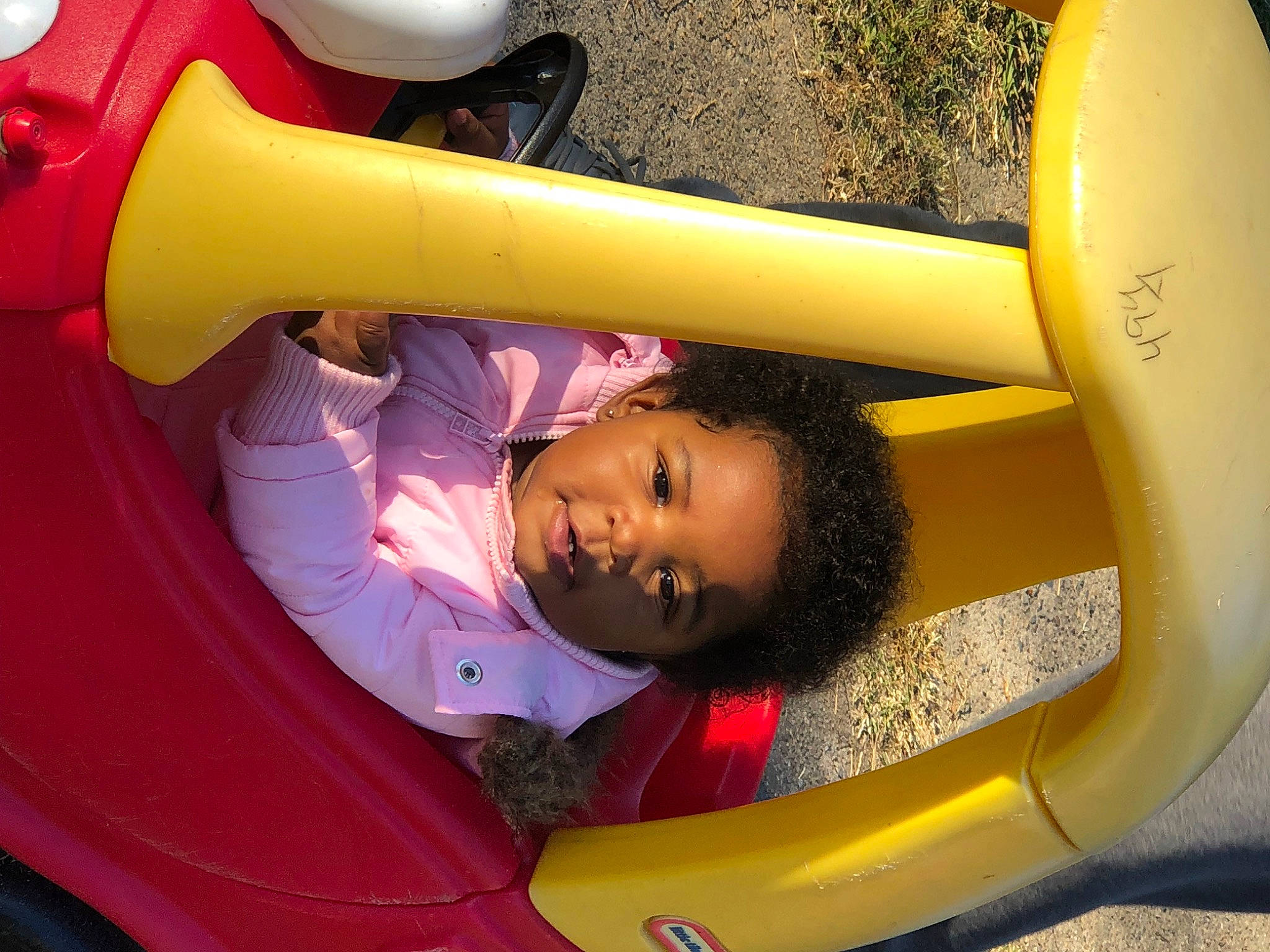 Brinleigh joined the competition — help win amazing prizes! automotive_design, automotive_exterior, automotive_wheel_system, bumper, fender, fun, inflatable, leisure, light, motor_vehicle, organ, person, photograph, recreation, red, snapshot, toddler, vehicle, vehicle_door, white