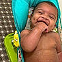 Madden joined the competition — help win amazing prizes! baby, infant, smiling, happy, chewing, hand, water_droplets, baby_chair, colorful, dimples, cute, skin, face, young_child, indoors, playful, seated, child, person, expression