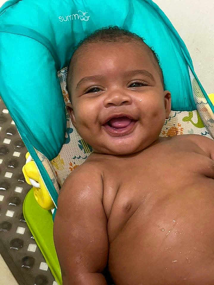 Madden joined the competition — help win amazing prizes! baby, smiling, infant, dimples, child, bare_chest, seat, baby_seat, water_droplets, happy, cute, indoors, person, skin, face, expression, young_child, joyful, plush, colorful