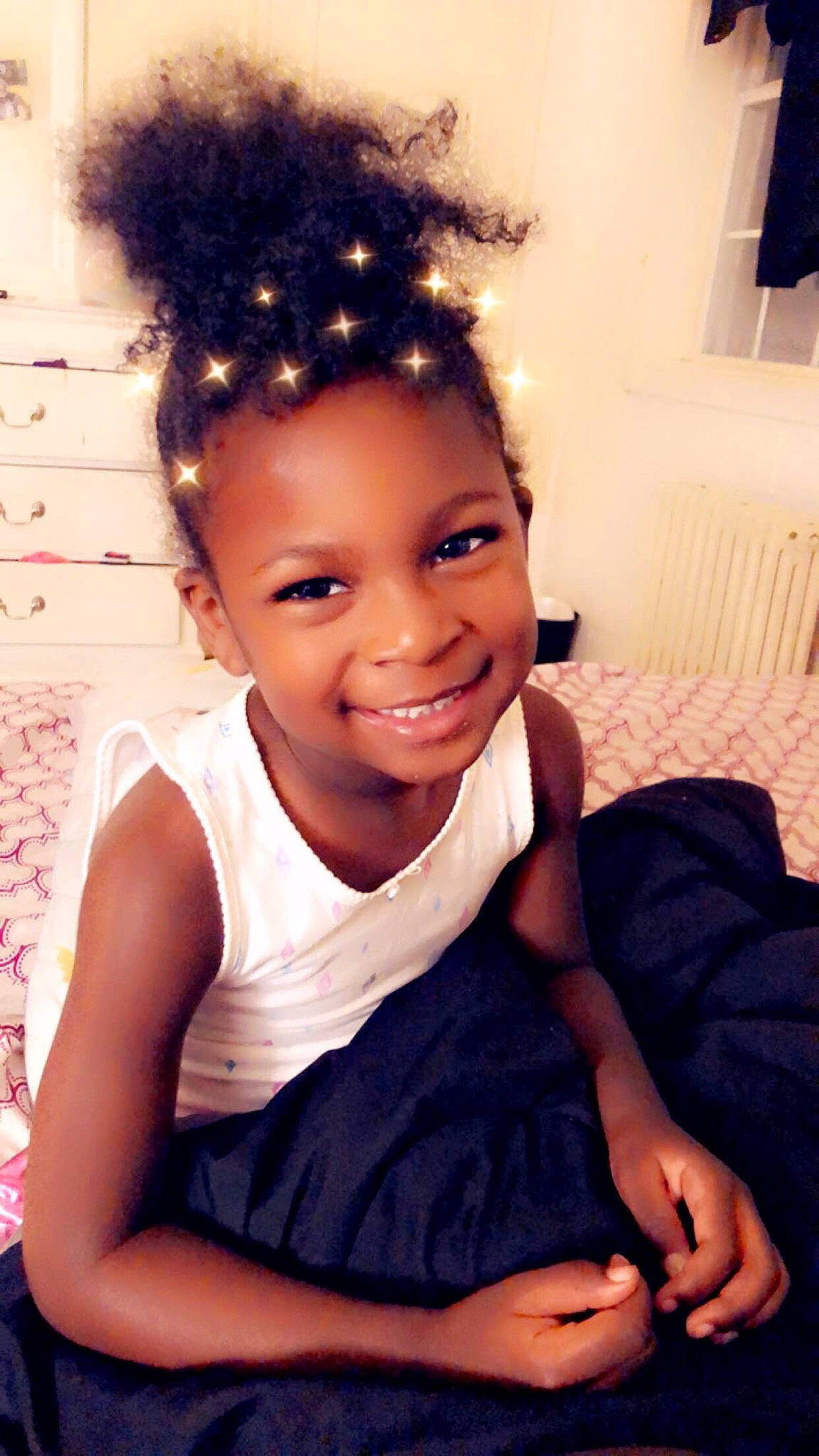 Azaria is registered to the contest to win money with this photo: baby, baby_toddler_clothing, black_hair, child_model, day_dress, eye, eyebrow, forehead, hair_accessory, hairstyle, happy, headpiece, jheri_curl, joy, laugh, nail, person, skin, style, thumb