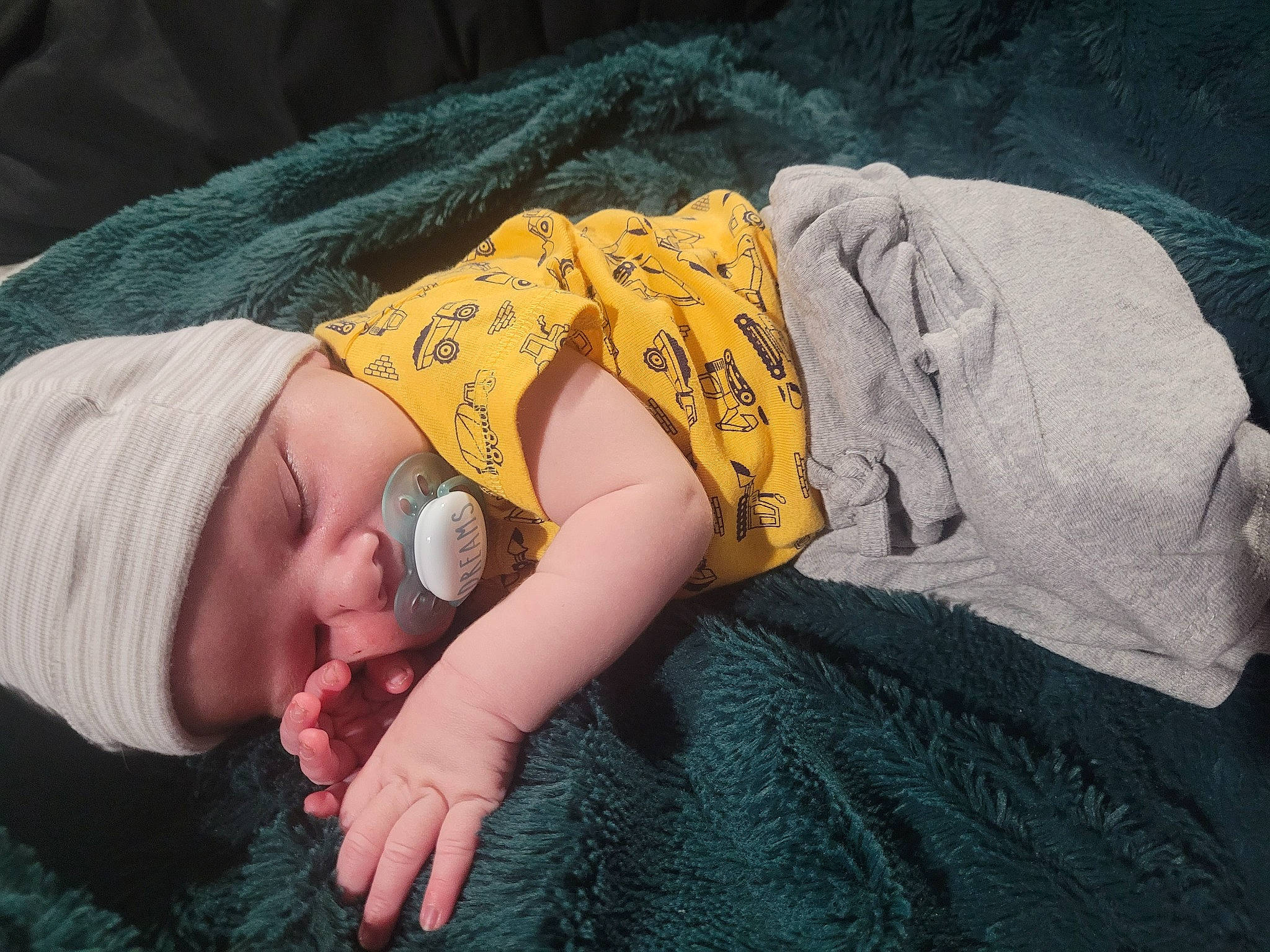 Dante joined the competition — help win amazing prizes! baby, baby_toddler_clothing, child, comfort, finger, grass, hand, headgear, human_body, human_leg, knit_cap, linens, mouth, nap, person, sitting, skin, sleeve, toddler, tree