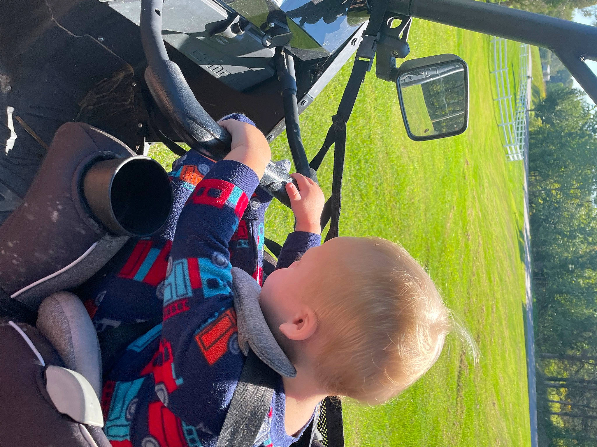 Mathias joined the competition — help win amazing prizes! adventure, air_sports, automotive_exterior, baby, baseball_cap, fun, grass, hat, leisure, person, personal_protective_equipment, plant, recreation, shorts, suit, sunglasses, tie, toddler, tree, vacation